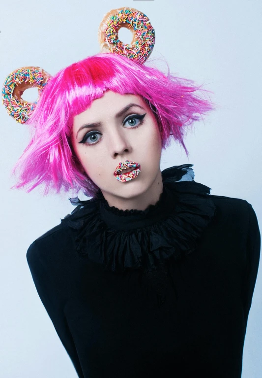 a woman with pink hair and donuts on her head, an album cover, inspired by Kaja Foglio, unsplash, gummy bear, lexi belle, 1 7 - year - old goth girl, profile image