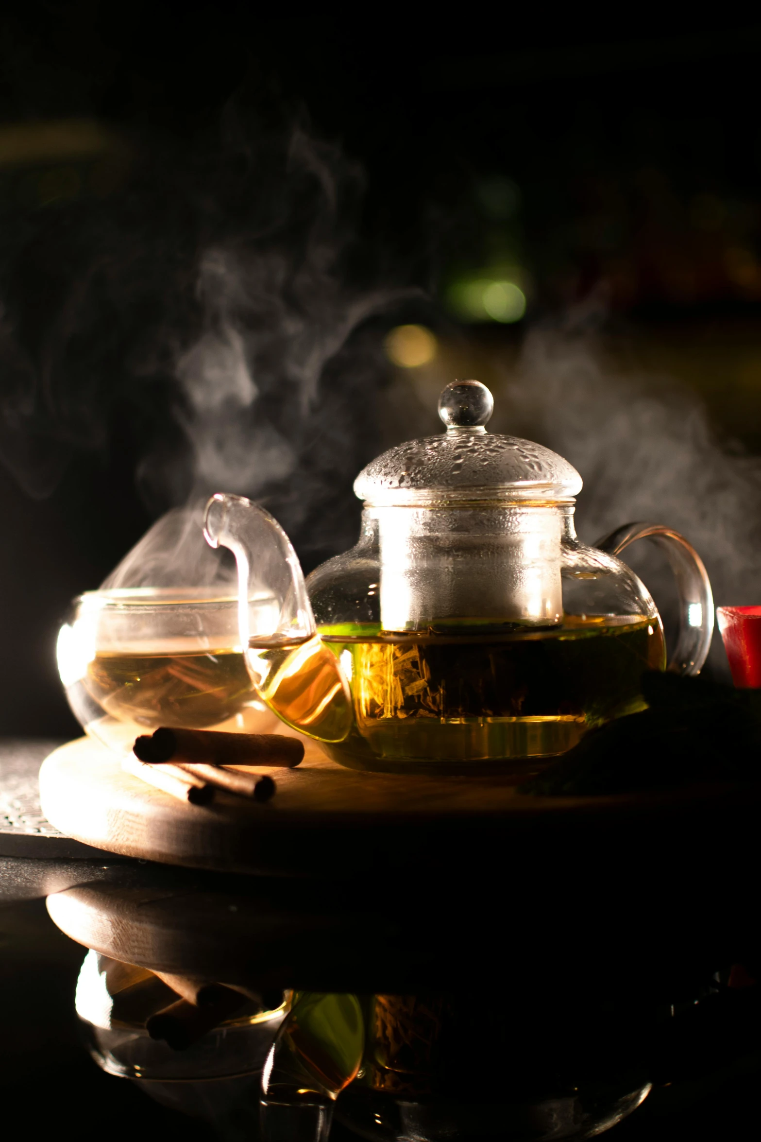 a tea pot sitting on top of a wooden tray, a still life, pexels, lights and smoke, taverns nighttime lifestyle, green tea, enhanced