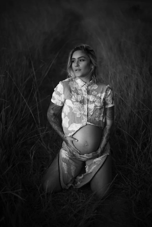 a black and white photo of a pregnant woman, inspired by Elsa Bleda, tumblr, realism, tattooed, golden hour, alternate album cover, cowgirl