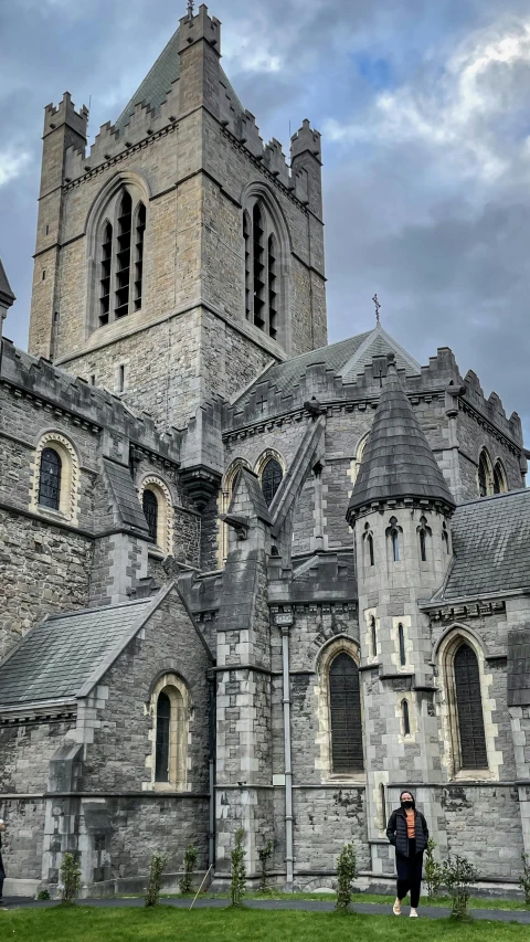 a couple of people that are standing in front of a building, by Ben Thompson, pexels contest winner, romanesque, photographic isometric cathedral, ireland, high detailed close up of, square