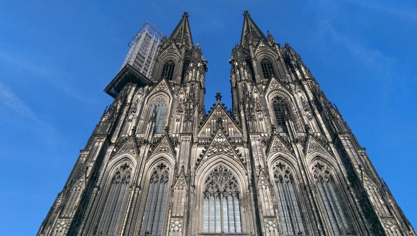 a very tall cathedral with a clock on it's side, pexels contest winner, 🚿🗝📝, german renaissance architecture, buildings carved out of stone, gothic rich deep colors