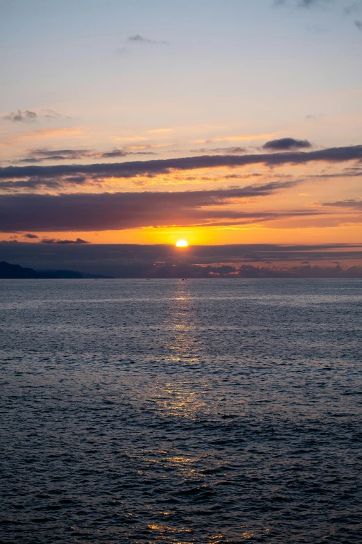 a large body of water with a sunset in the background, azores, slightly smiling, abel tasman, uncropped