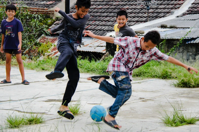 a group of young boys playing a game of soccer, a picture, pexels contest winner, happening, square, indonesia, sassy pose, 2045