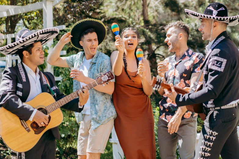 a group of people standing next to each other holding guitars, holding maracas, performing a music video, delightful surroundings, profile image