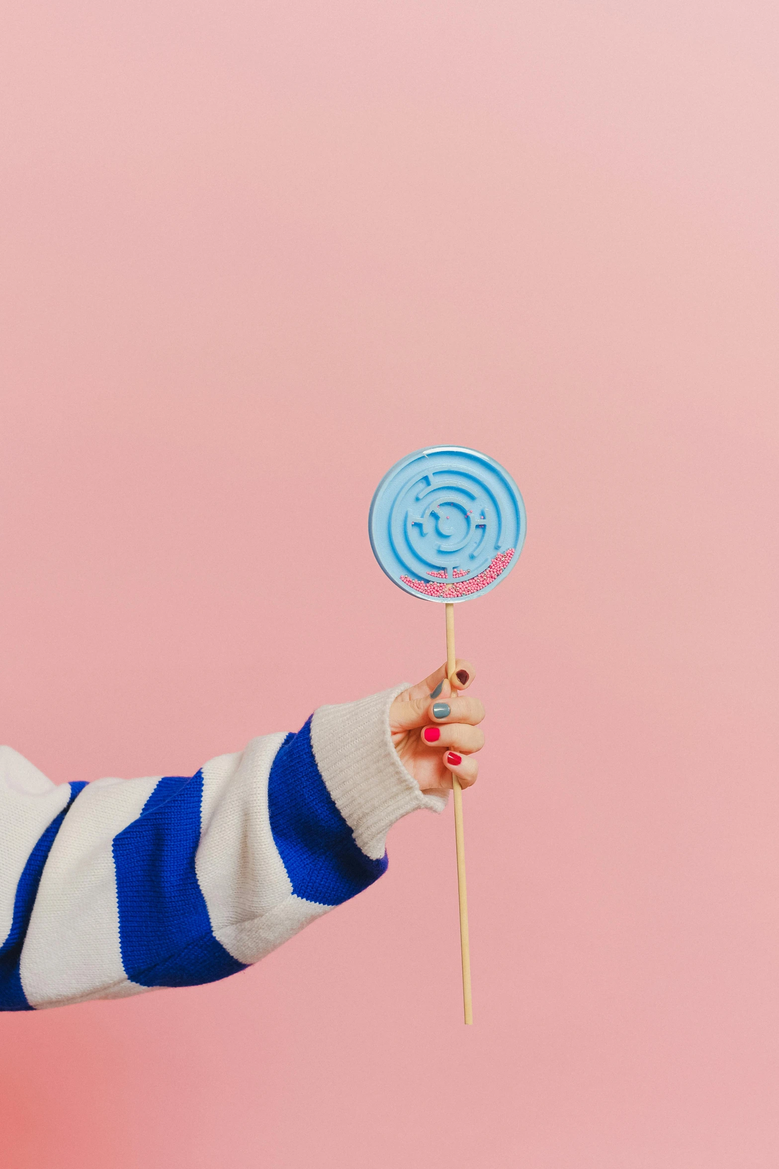 a little girl holding a lollipop in one hand and a lollipop in the other, trending on pexels, pop art, lightblue acrylic paintdrip tar, soft aesthetic, product introduction photo