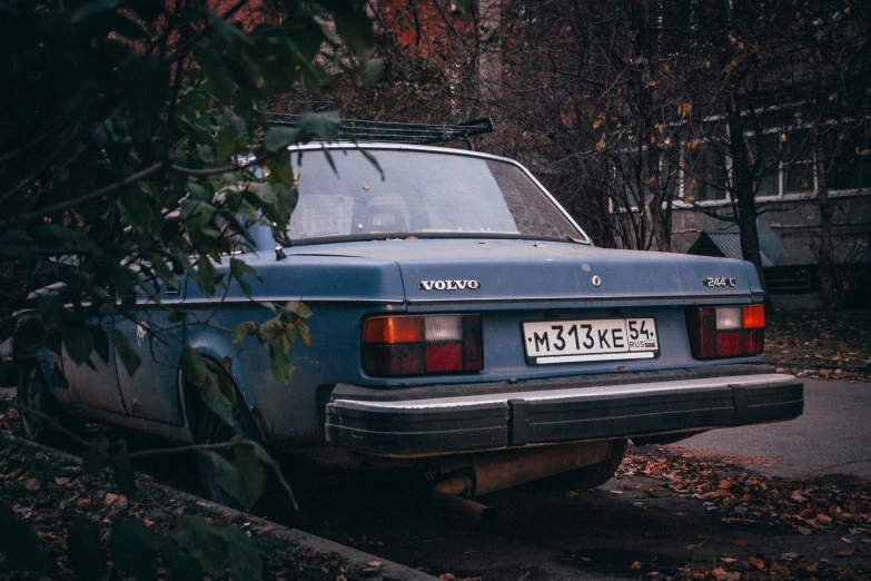 a blue car parked on the side of the road, inspired by Elsa Bleda, pexels contest winner, renaissance, soviet yard, square, 000 — википедия, fall season