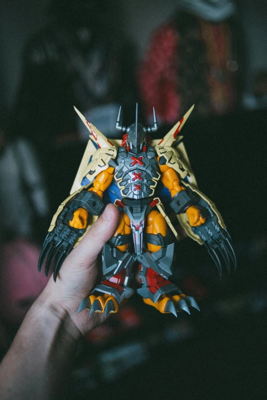 a person holding a toy in their hand, warhammer model, big claws, taken in the late 2000s, ssss.gridman