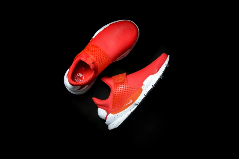a pair of red sneakers on a black background, unsplash, dada, gradient white to red, engineered, duck, essence