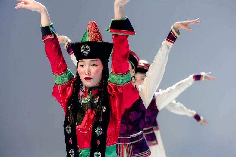 a group of people standing on top of a stage, inspired by Li Di, cloisonnism, colourful clothing, classic dancer striking a pose, inuk, white