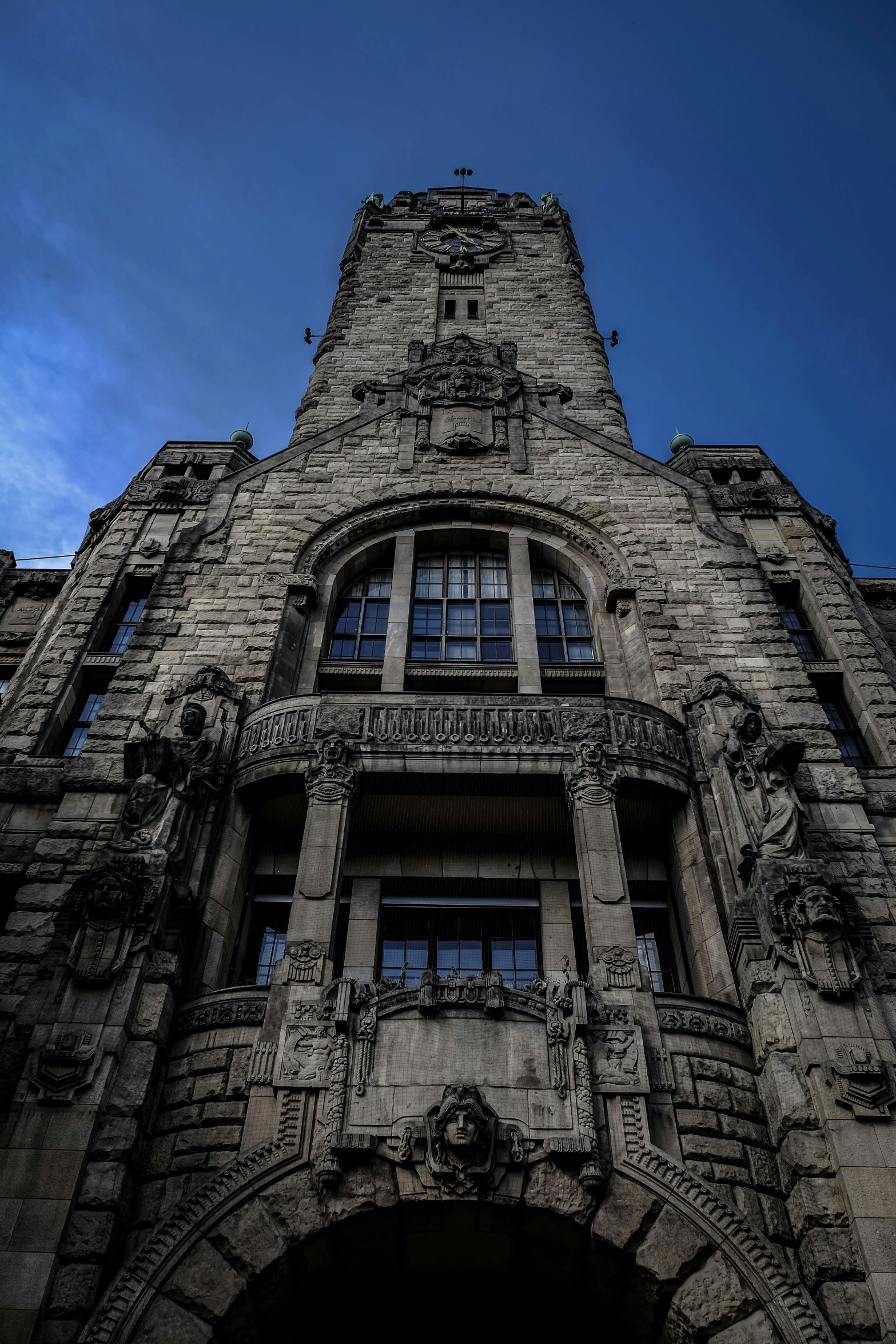 a tall building with a clock on top of it, highly detailed stonework, hannover, cleveland, haunted