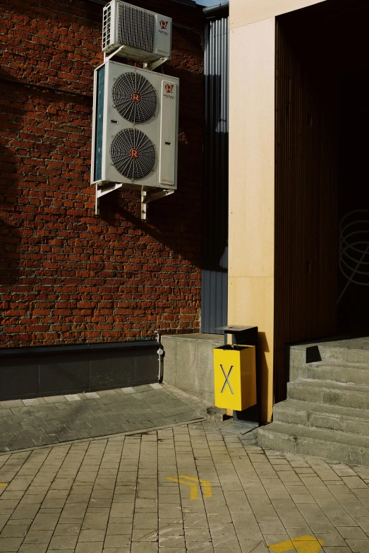 an air conditioner on the side of a building, an album cover, by Sven Erixson, postminimalism, yellow light, traffic signs, hyperrealistic image of x, radiator