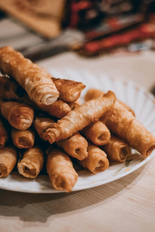 a close up of a plate of food on a table, scrolls, thumbnail, nuttavut baiphowongse, crispy