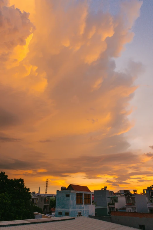 a fire hydrant sitting on top of a roof under a cloudy sky, a picture, by Jan Tengnagel, pexels contest winner, sunset panorama, giant cumulonimbus cloud, yellow sky, today\'s featured photograph 4k