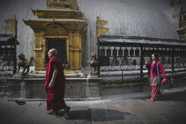 a couple of people walking down a street, a picture, inspired by Steve McCurry, unsplash contest winner, nepal, in an ancient altar, portrait of monk, in colour