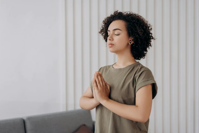 a woman doing yoga in her living room, a statue, trending on pexels, hurufiyya, half - closed eyes, indian girl with brown skin, animation, hands crossed