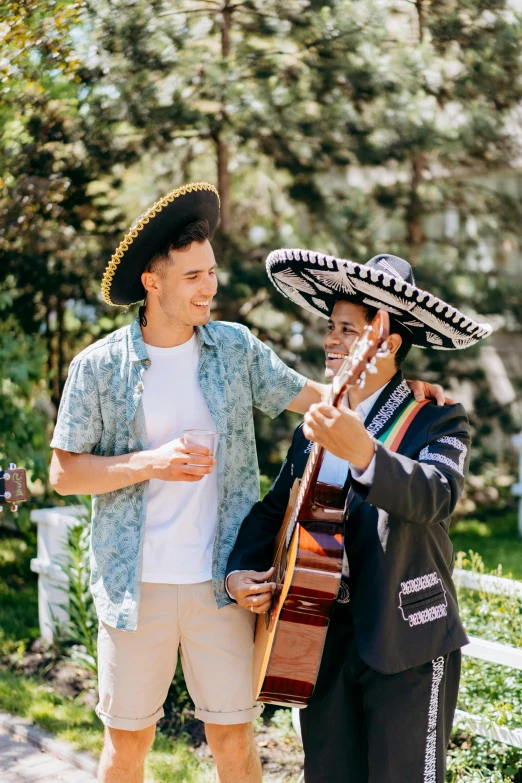 a man standing next to a woman holding a guitar, sombrero, profile image, wedding, cheers