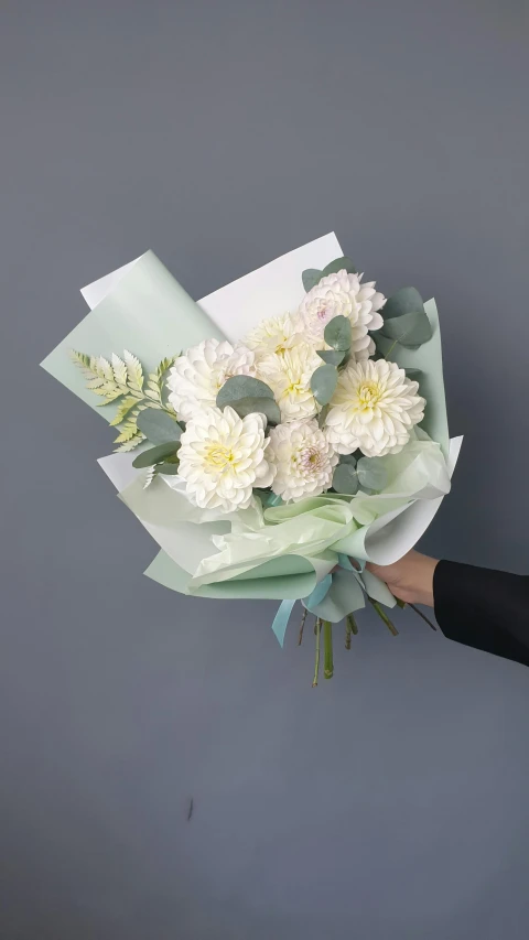 a woman holding a bouquet of white flowers, modern pastel colours, paper chrysanthemums, award winning, comforting