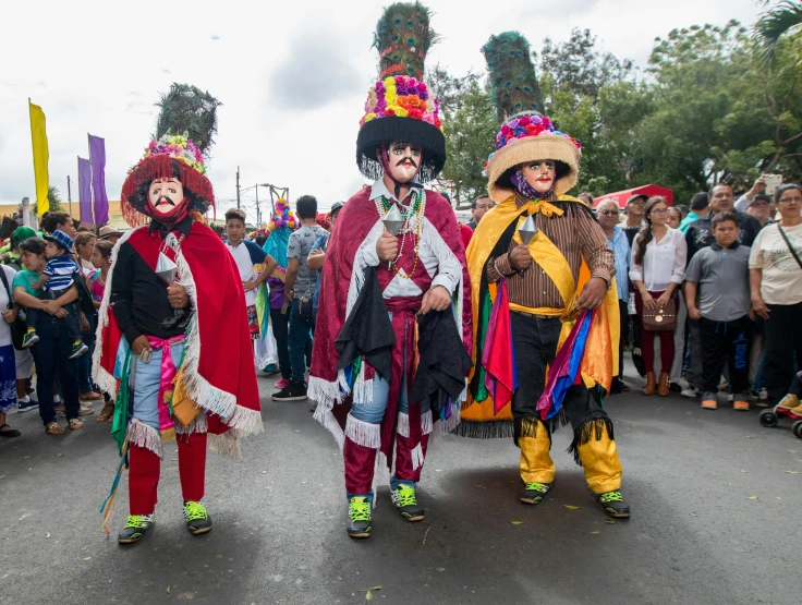 a group of people that are standing in the street, by Alejandro Obregón, pexels contest winner, elaborately costumed, the three moiras, pacal votan, promo image