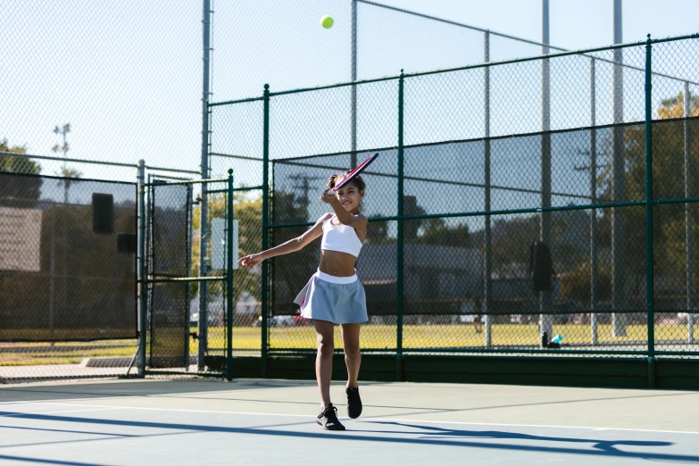 a woman swinging a tennis racquet on a tennis court, unsplash, square, panoramic view of girl, high school, shot on sony a 7 iii