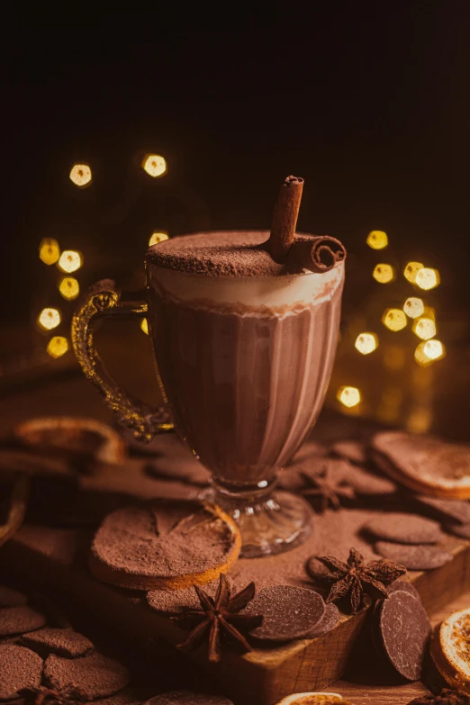 a glass of hot chocolate sitting on top of a table, festive atmosphere, at night time, ivory and copper, thumbnail