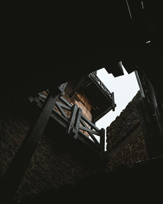 a black and white photo of a clock tower, an album cover, by Attila Meszlenyi, pexels contest winner, renaissance, mud and brick houses, balcony, collapsed ceiling, back alley