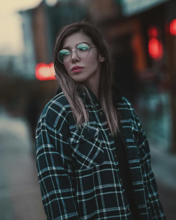 a woman wearing glasses and a plaid shirt, inspired by Elsa Bleda, trending on pexels, teal lights, trending on r/streetwear, lgbtq, attractive photo