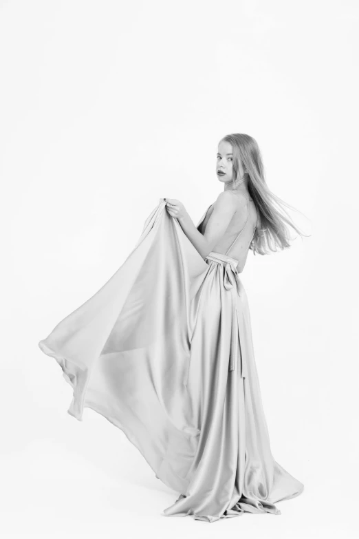 a black and white photo of a woman in a dress, conceptual art, flowing blonde hair, set against a white background, 15081959 21121991 01012000 4k, large draped cloth
