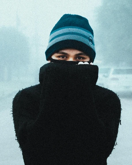 a close up of a person wearing a hat and scarf, an album cover, antipodeans, winter storm, gif, male teenager, intimidating stance