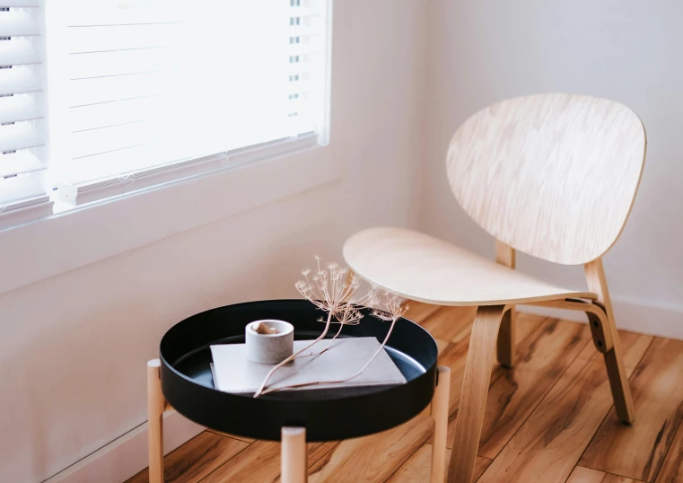 a chair and a table in a room, trending on unsplash, minimalism, carrying a tray, on a coffee table, round format, product introduction photo