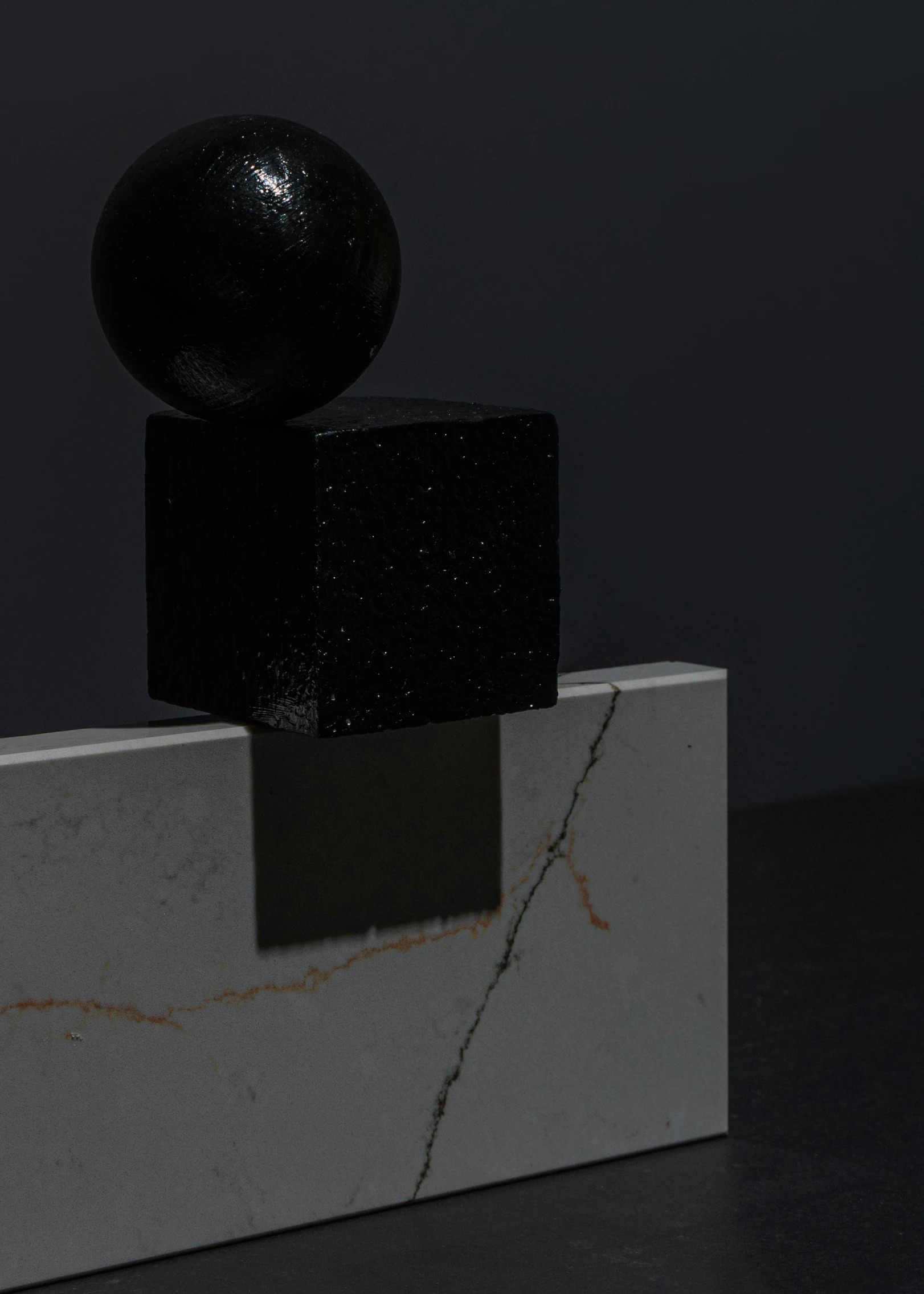 a black ball sitting on top of a marble block, by Harvey Quaytman, conceptual art, sci - fi details, david kassan, black lacquer, square