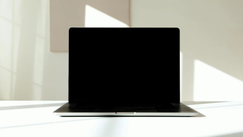 a laptop computer sitting on top of a white table, by Carey Morris, gradient black to silver, high shadow, thumbnail, panel of black
