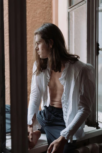 a shirtless man sitting on a window sill, an album cover, inspired by Elsa Bleda, unsplash contest winner, renaissance, wearing lab coat and a blouse, portrait androgynous girl, laetitia casta, portrait featured on unsplash