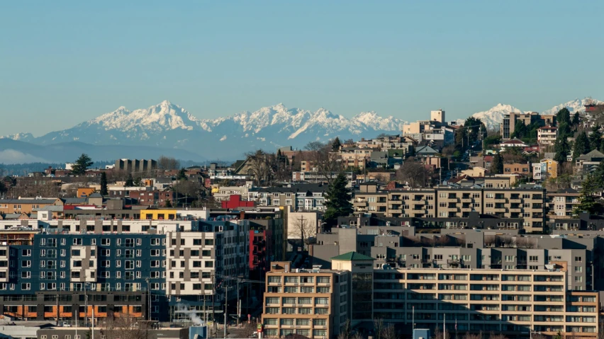 a view of a city with mountains in the background, by Meredith Dillman, unsplash, ballard, gigapixel photo, 2000s photo, high quality image”