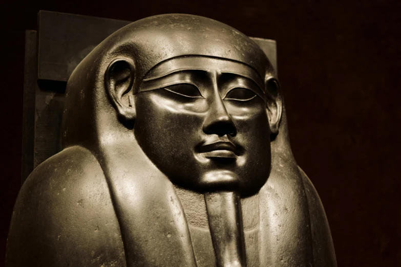 a close up of a statue of a person, egyptian art, pexels contest winner, art nouveau, sleek metal head, metropolitan museum collection, resting, ambeint