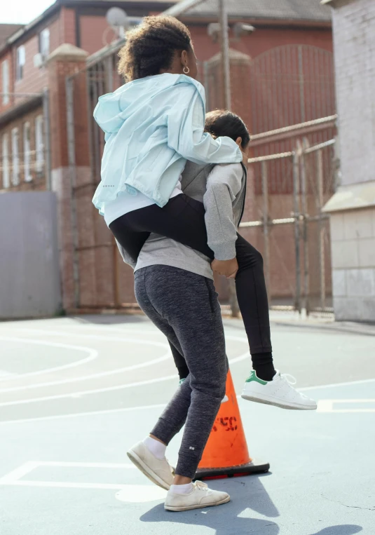 a couple of people standing on top of a basketball court, a picture, hugging her knees, cone shaped, trending on r/streetwear, working out