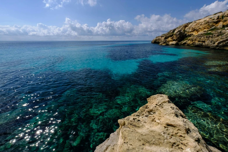 a large body of water next to a cliff, pexels contest winner, les nabis, cyprus, coral reefs, ibiza, thumbnail