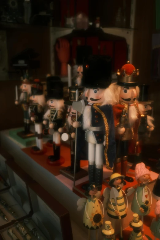 a bunch of nutcrackers sitting on top of a table, an album cover, flickr, cinematic shot!, slide show, ( ( theatrical ) ), color footage