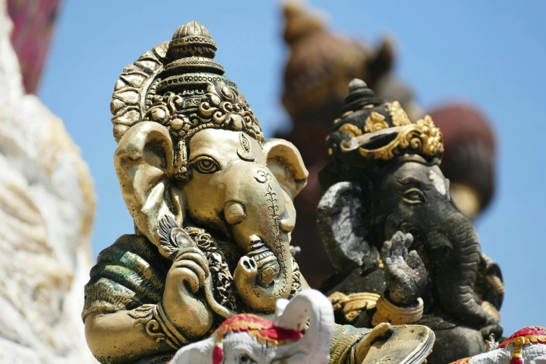 a close up of a statue of an elephant, a statue, unsplash, ganesha, square, dressed in ornate, on a sunny day