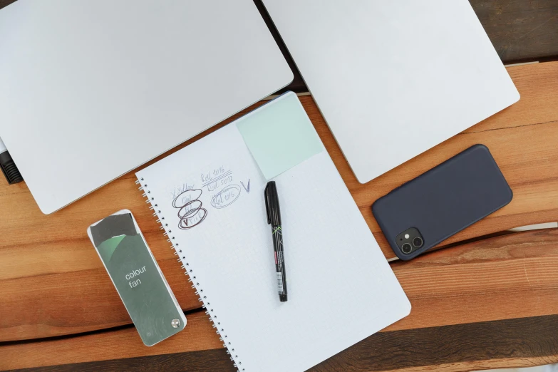 an open laptop computer sitting on top of a wooden table, a drawing, trending on pexels, scanning items with smartphone, whiteboards, cell cover style, felt tip pen