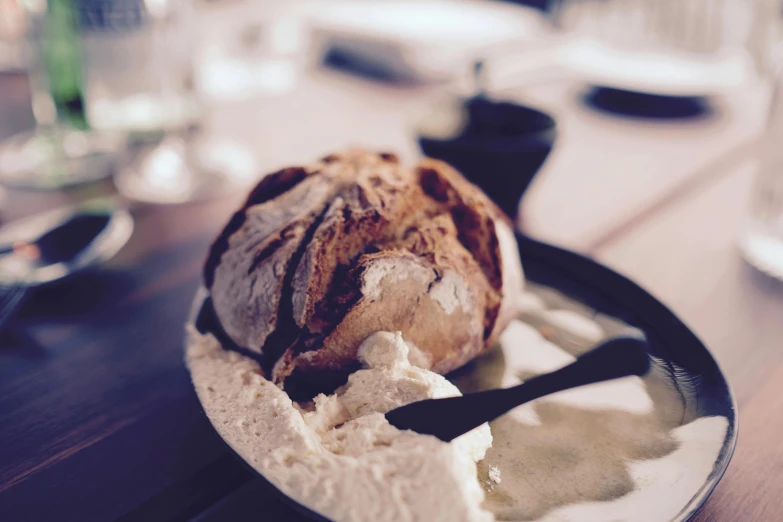 a close up of a plate of food on a table, a photo, unsplash, renaissance, bread, covered in white flour, australian, grain”