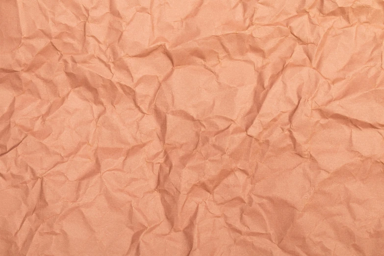 a close up of a sheet of brown paper, an album cover, inspired by Christo, trending on pexels, figuration libre, coral red, paper crumpled texture, glowing peach face, pastel pink