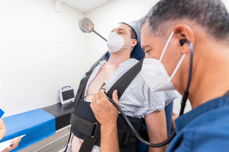 a doctor examining a patient's chest with a stethoscope, a photo, by Daniel Lieske, instagram, massurrealism, sydney, full body 8k, with electric arc device, tourist photo