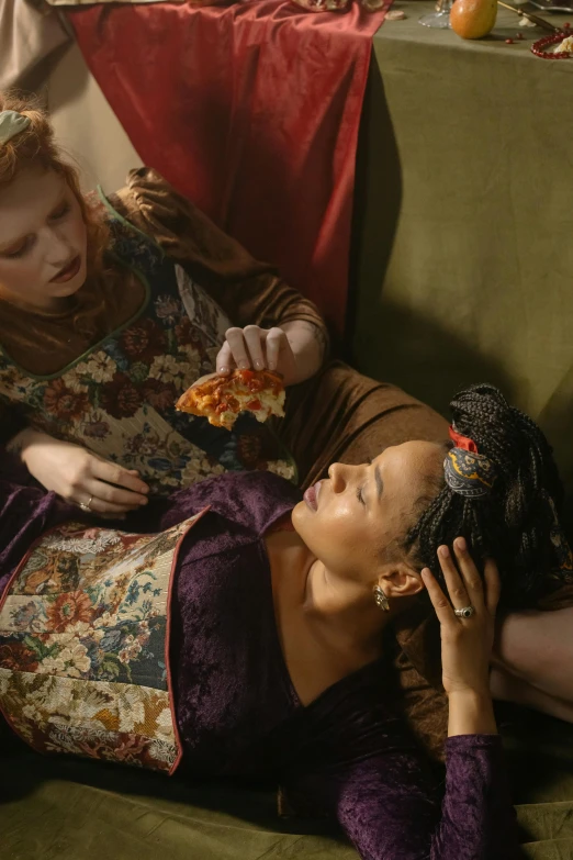 two women sitting on a couch eating pizza, inspired by Ford Madox Brown, renaissance, wide film still, sansa, ignant, renaissance fair