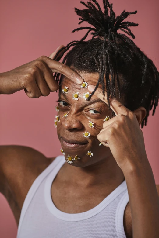 a woman with sprinkles on her face, by Ellen Gallagher, trending on pexels, renaissance, black teenage boy, chamomile, facial muscles, flowers growing out of his body