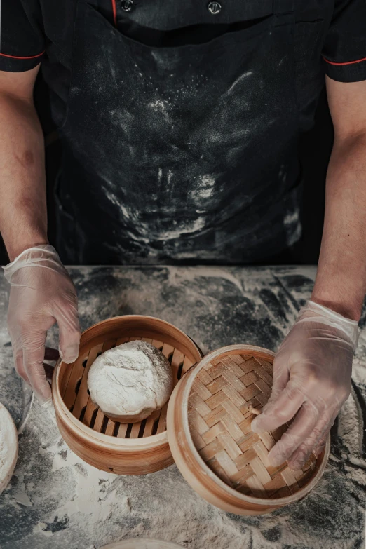 a close up of a person preparing food on a table, steamed buns, dirty linen robes, ultra textured, 4l