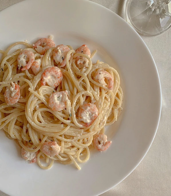 a white plate topped with pasta and shrimp, by Tom Wänerstrand, with soft pink colors, thumbnail, full device, cream