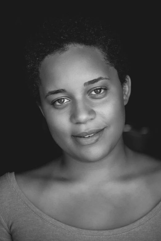 a black and white photo of a woman, inspired by Carrie Mae Weems, acting headshot, joel fletcher, dark natural glow, douglas smith