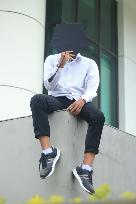a man sitting on a ledge holding an umbrella, inspired by Gang Hui-an, unsplash, realism, wearing white sneakers, face covered, wearing white shirt, trending on r/techwearclothing
