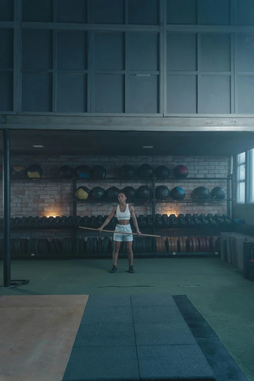 a woman doing a jump rope in a gym, by Elsa Bleda, process art, cinematic lut, scene from live action movie, lifting weights, lee madgwick & liam wong