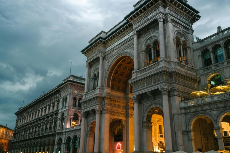 a large building with a clock on top of it, a marble sculpture, inspired by Michelangelo Buonarotti, pexels contest winner, archways between stalagtites, evening lights, milan jozing, thumbnail